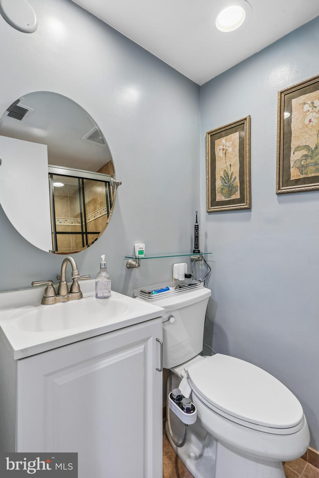 2 Foxhall Court Silver Spring, MD 20906 - Photo 60 of 86 a bathroom with a toilet a sink and mirror