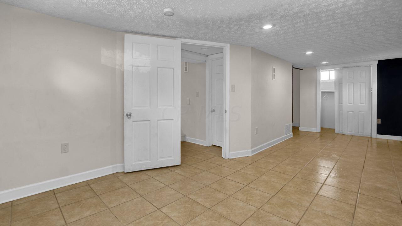 513 Elaine Road Columbus, OH 43213 - Photo 21 of 27 Basement Living Space