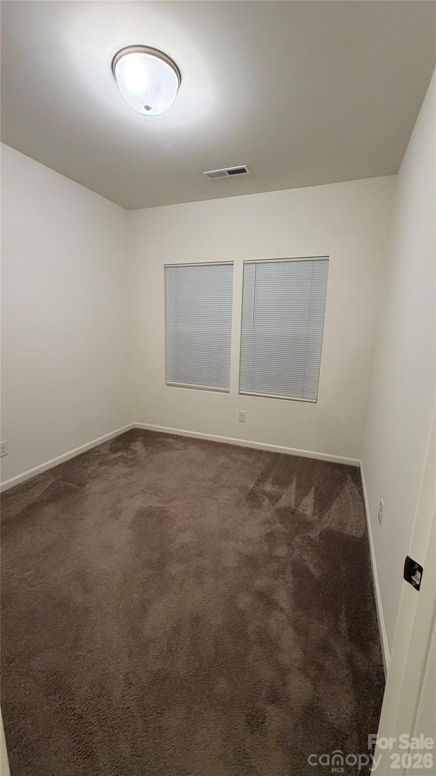 7209 Lenton Road, Unit 23 Charlotte, NC 28215 - Photo 15 of 17 an empty room with a empty space and window