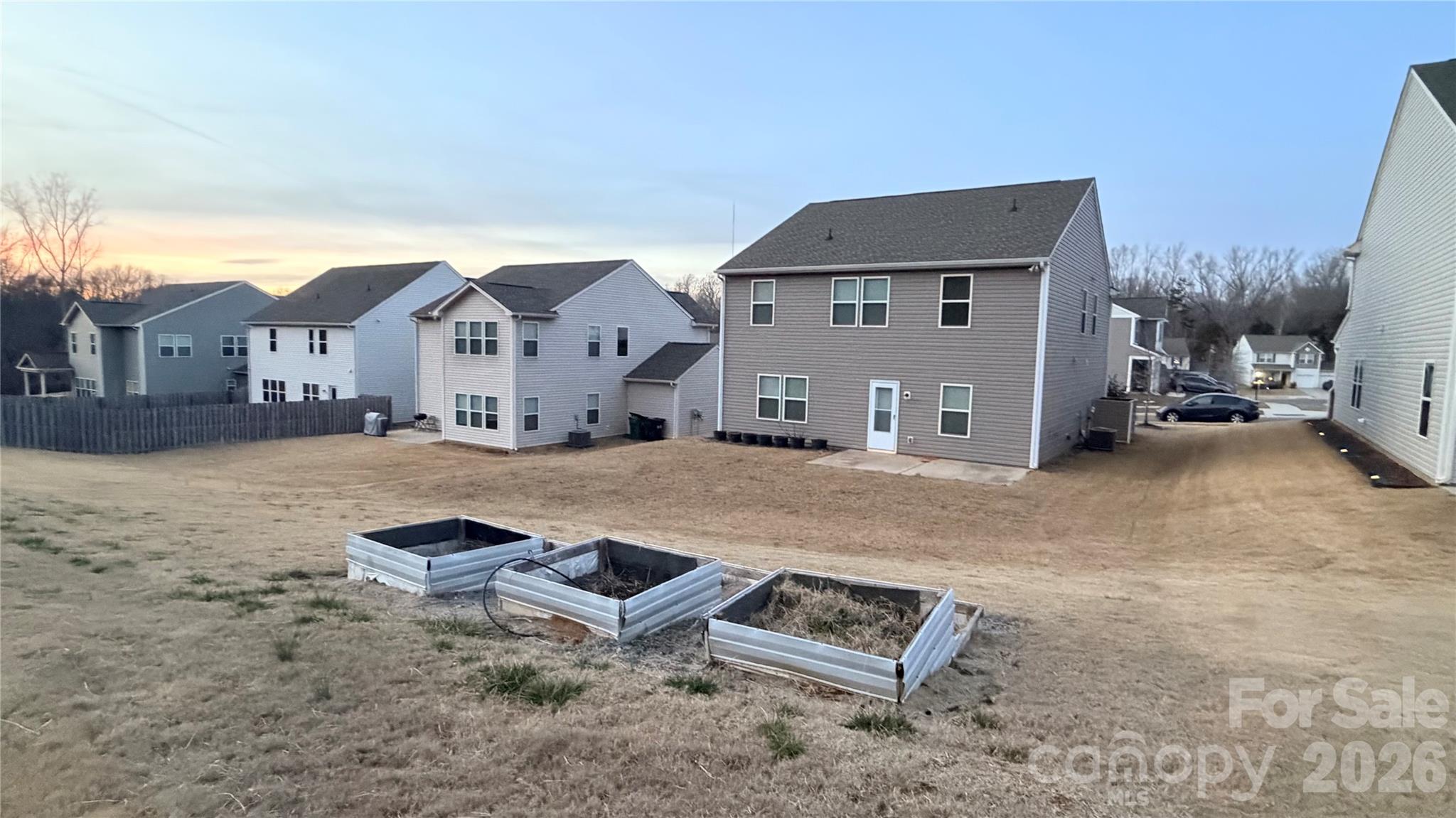 7209 Lenton Road, Unit 23 Charlotte, NC 28215 - Photo 3 of 17 a car parked in front of house