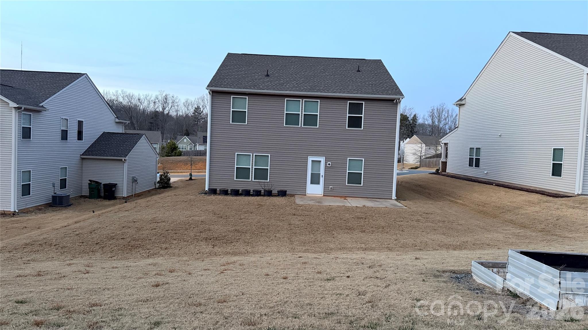 7209 Lenton Road, Unit 23 Charlotte, NC 28215 - Photo 4 of 17 a view of a house with a yard