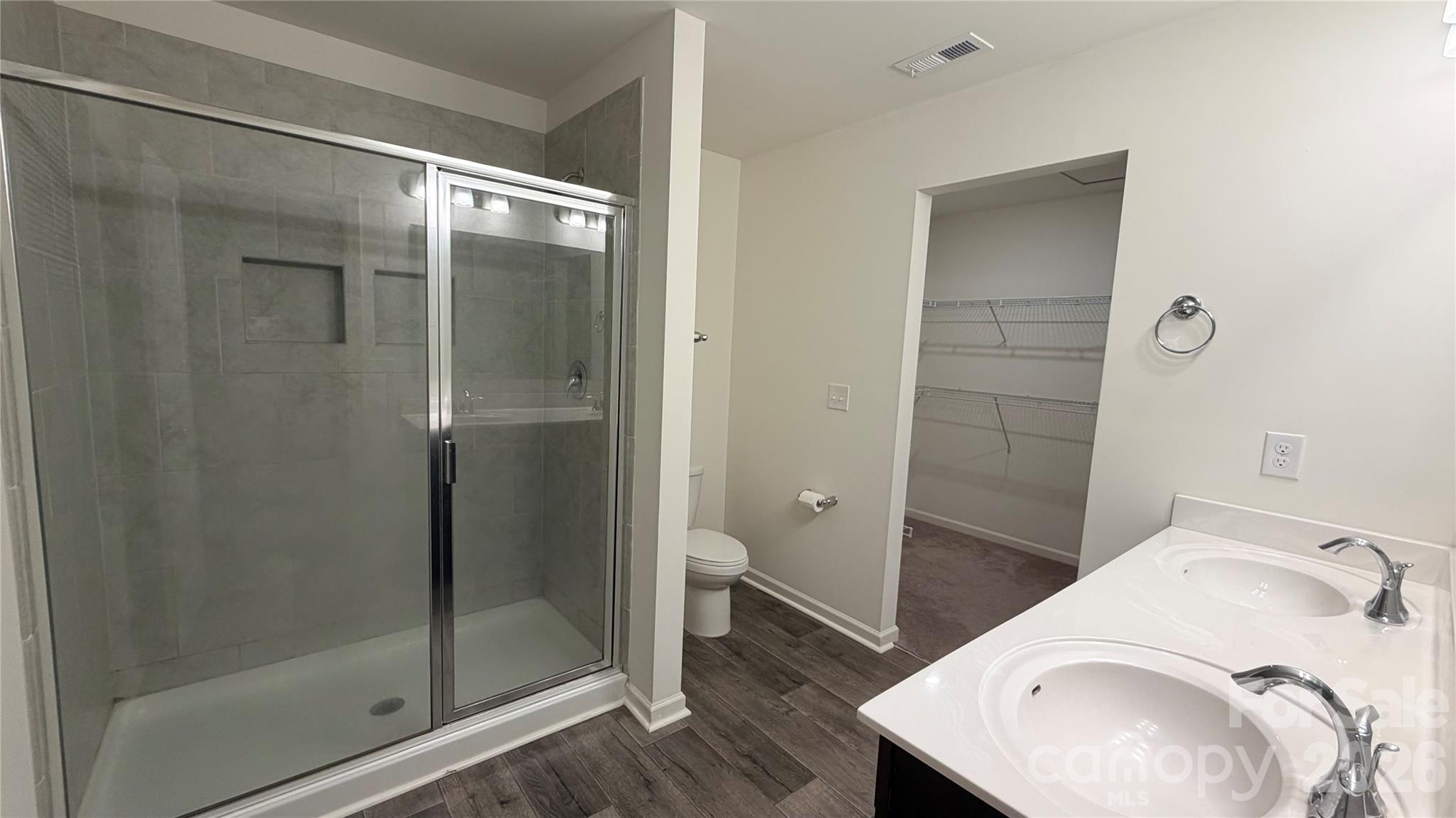 7209 Lenton Road, Unit 23 Charlotte, NC 28215 - Photo 10 of 17 a bathroom with a granite countertop sink toilet and shower