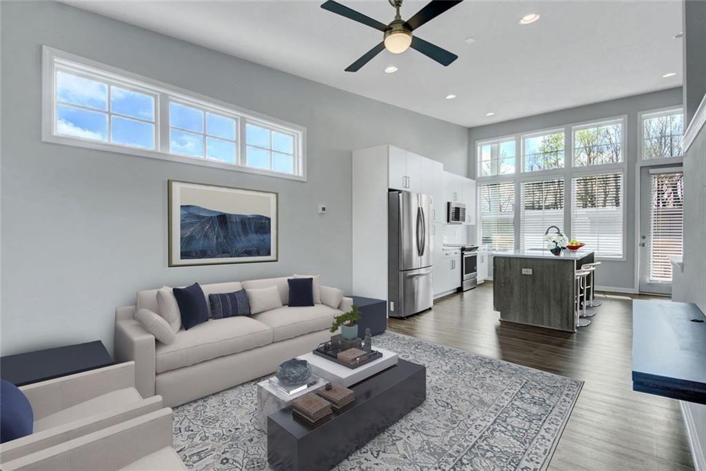 900 Brees Court Atlanta, GA 30318 - Photo 1 of 33 a living room with furniture wooden floor and a large window