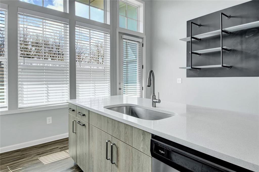 900 Brees Court Atlanta, GA 30318 - Photo 14 of 33 a kitchen with a sink and cabinets