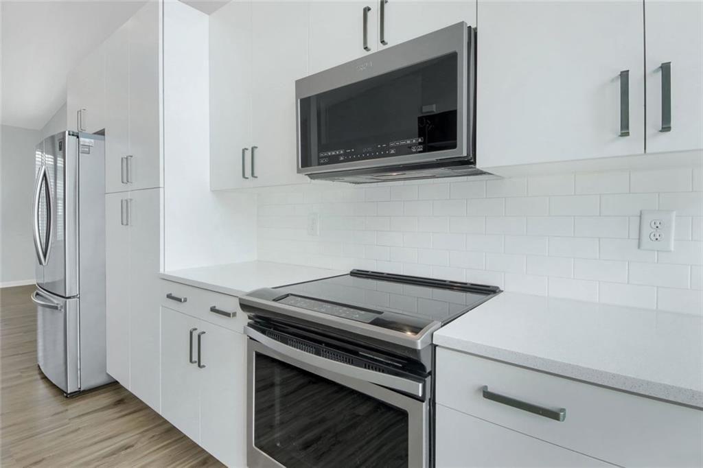 900 Brees Court Atlanta, GA 30318 - Photo 15 of 33 a kitchen with a stove and a microwave