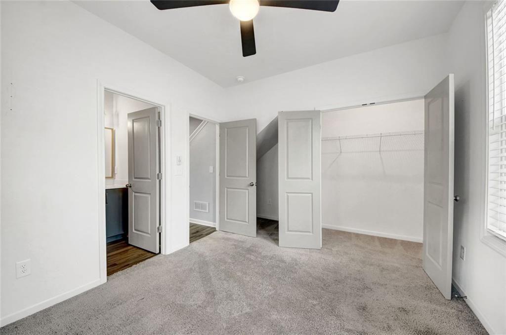 900 Brees Court Atlanta, GA 30318 - Photo 22 of 33 an empty room with closet and windows
