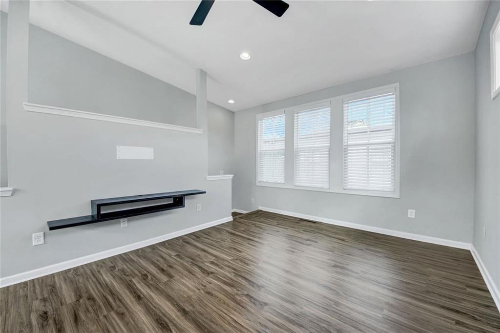 900 Brees Court Atlanta, GA 30318 - Photo 9 of 33 wooden floor in an empty room with a window