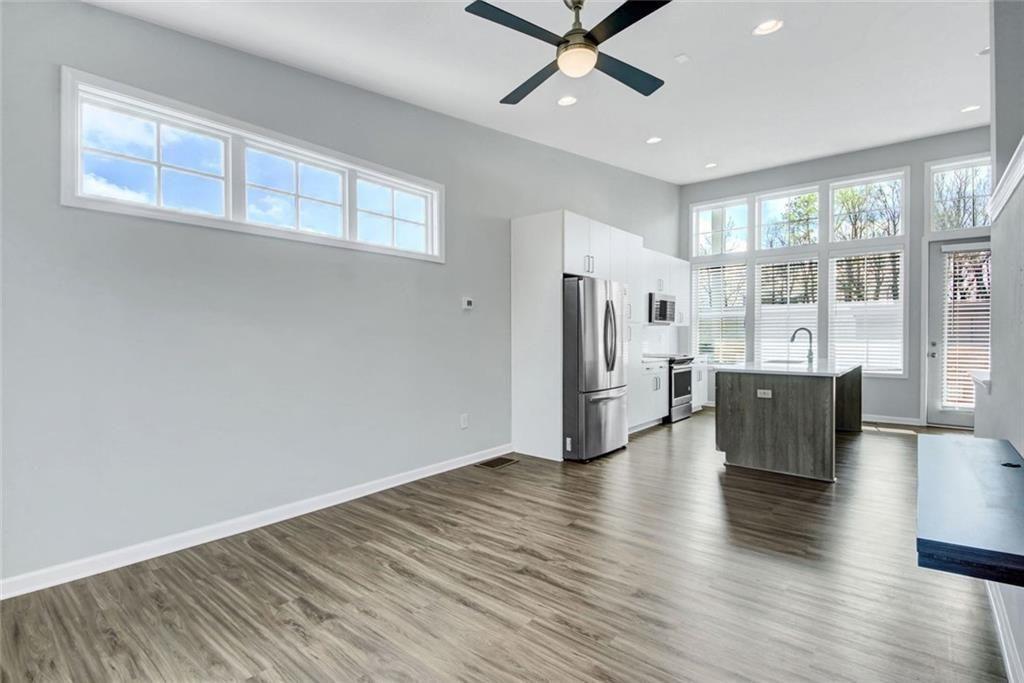 900 Brees Court Atlanta, GA 30318 - Photo 10 of 33 a view of an empty room with wooden floor and a window
