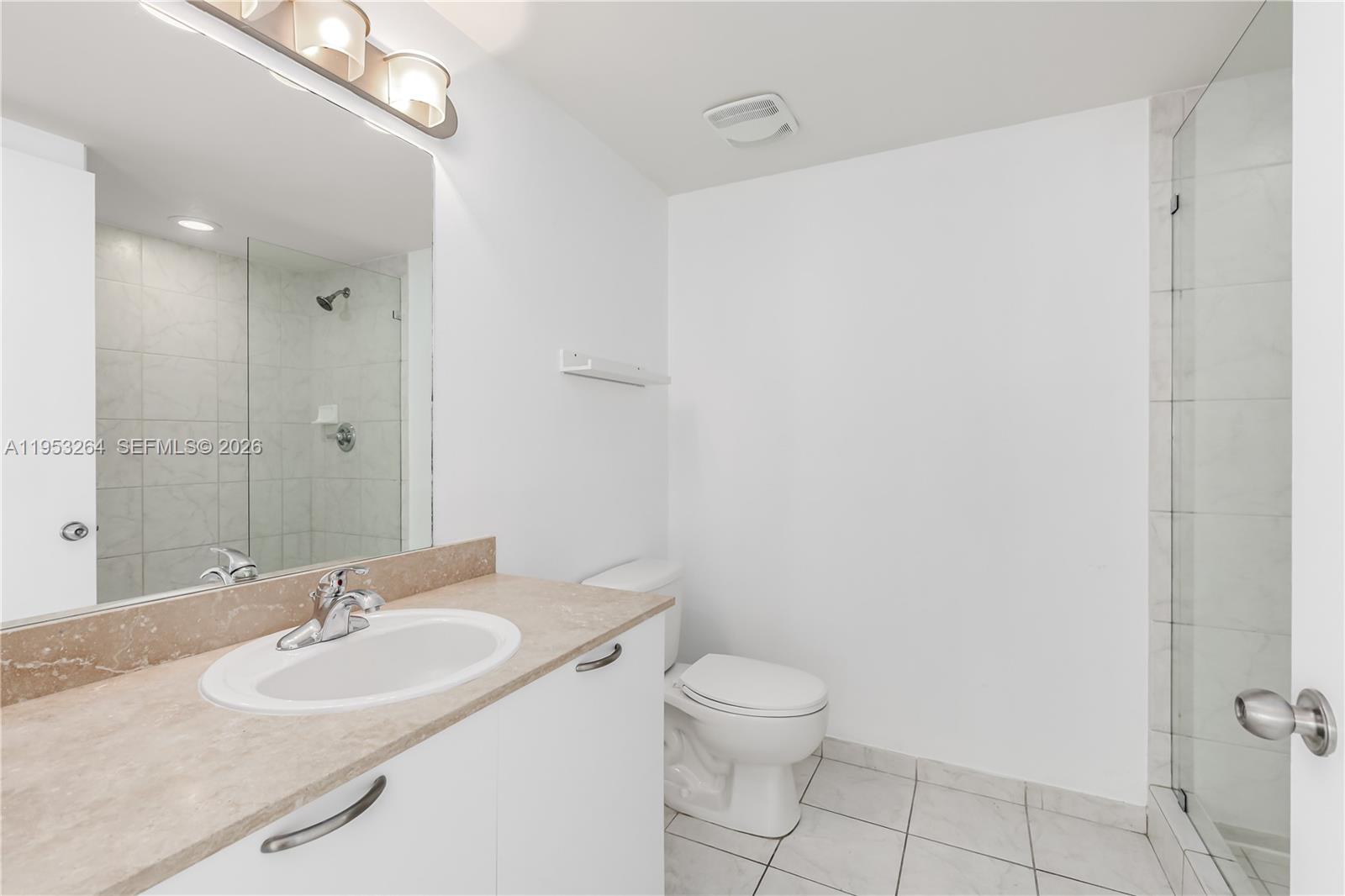 3180 Southwest 22nd Street, Unit 601 Miami, FL 33145 - Photo 21 of 29 a bathroom with a sink and a mirror