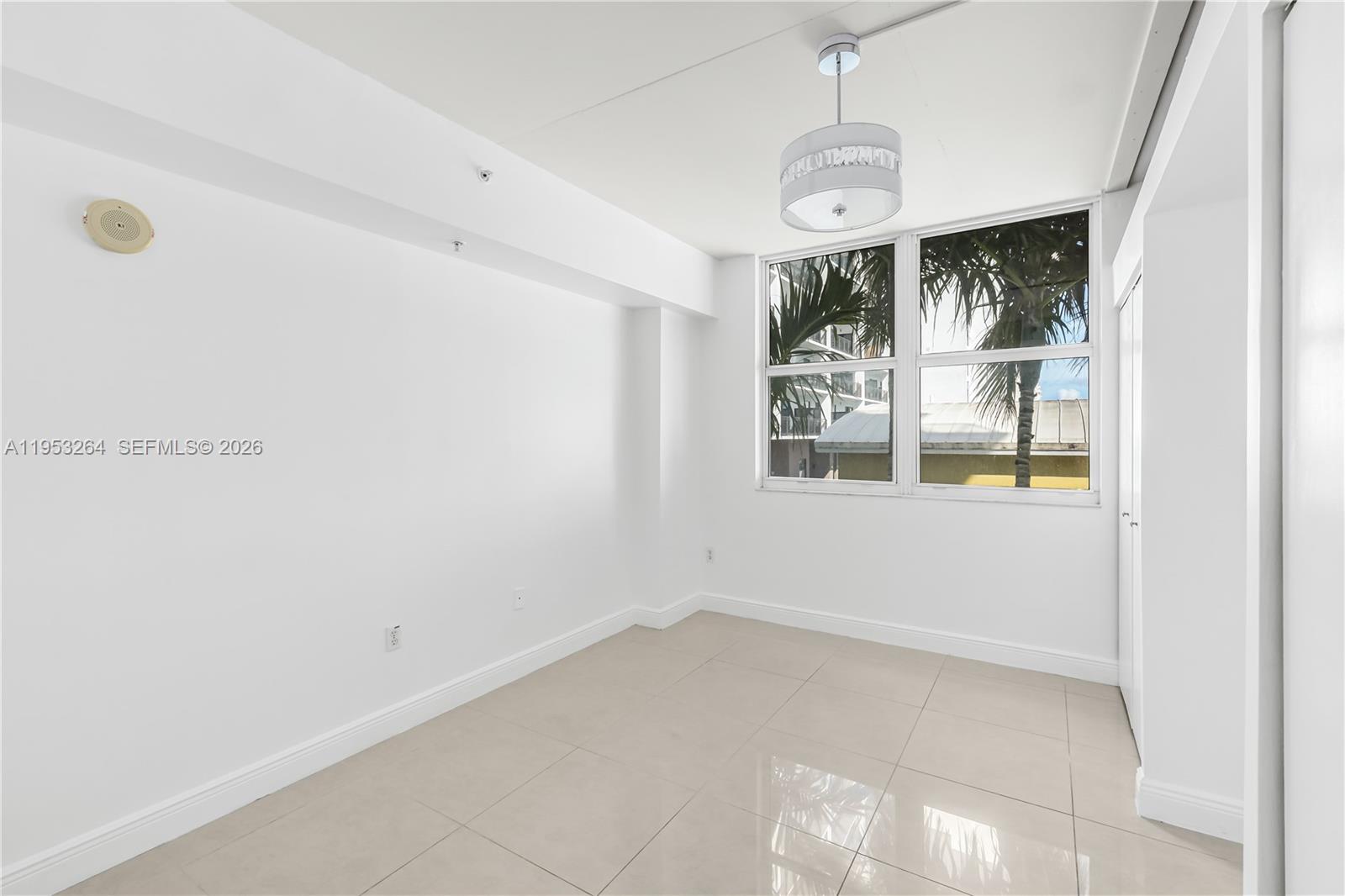 3180 Southwest 22nd Street, Unit 601 Miami, FL 33145 - Photo 24 of 29 a view of an empty room with a window