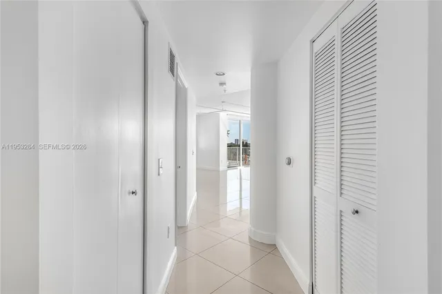 a bathroom with a shower and a glass door
