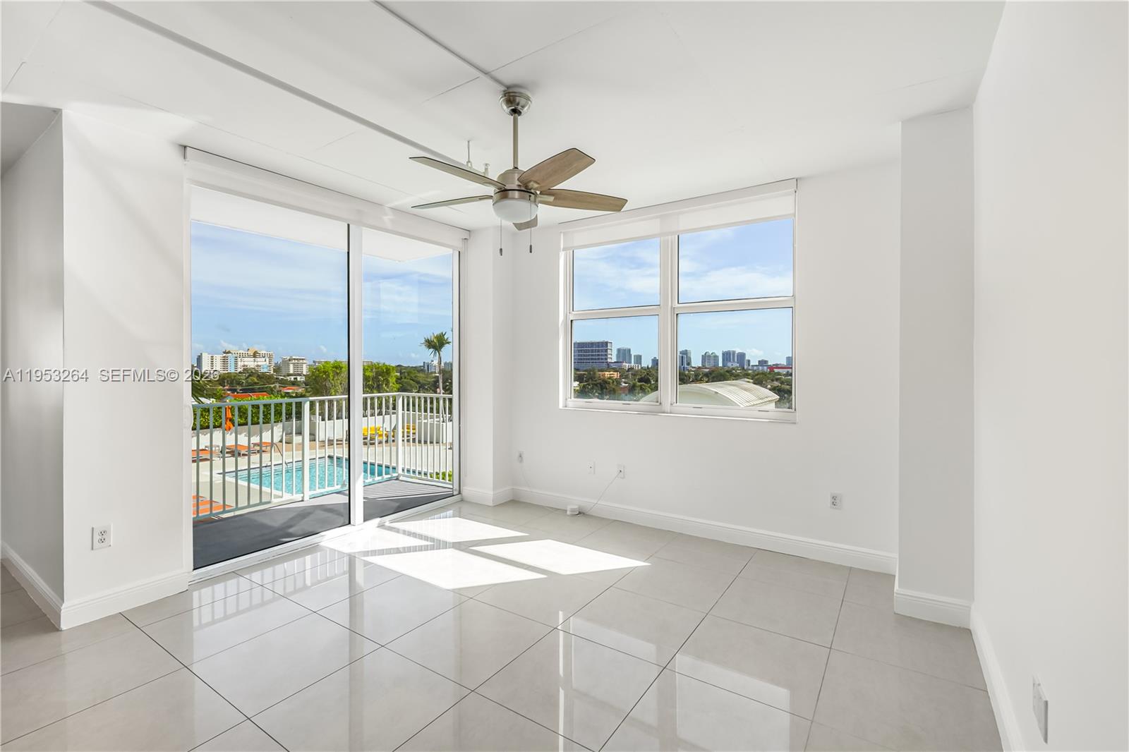 3180 Southwest 22nd Street, Unit 601 Miami, FL 33145 - Photo 9 of 29 an empty room with windows and balcony