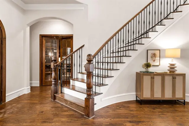 a view of entryway and hall with wooden floor