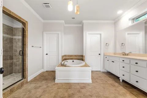 a utility room with cabinets a washer and dryer