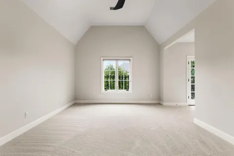 a view of an empty room with windows