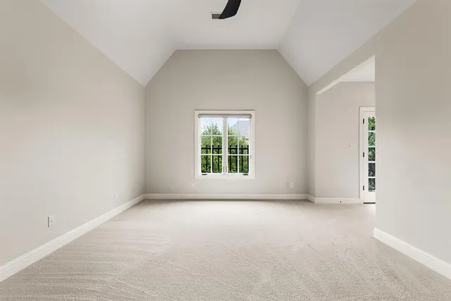 a view of an empty room with windows