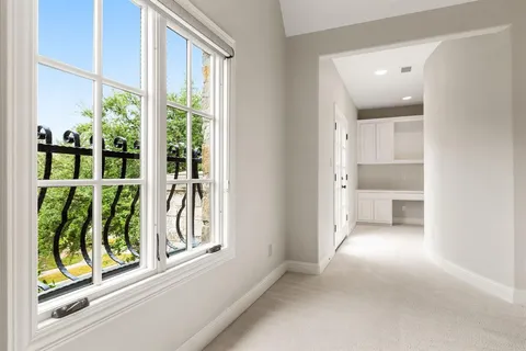 a view of a bathroom with a window and outside view