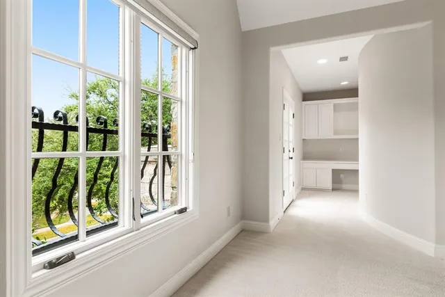 a view of a bathroom with a window and outside view