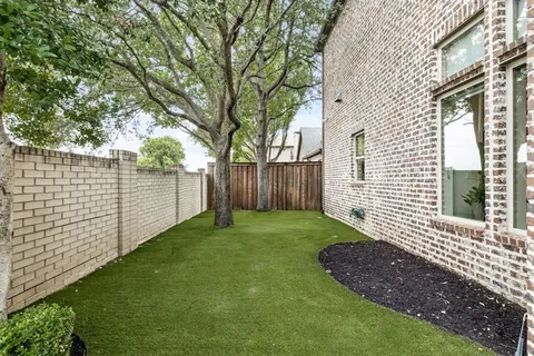 a view of a backyard with a trees