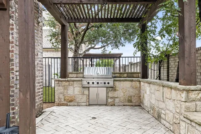 a kitchen with stainless steel appliances a stove and a refrigerator