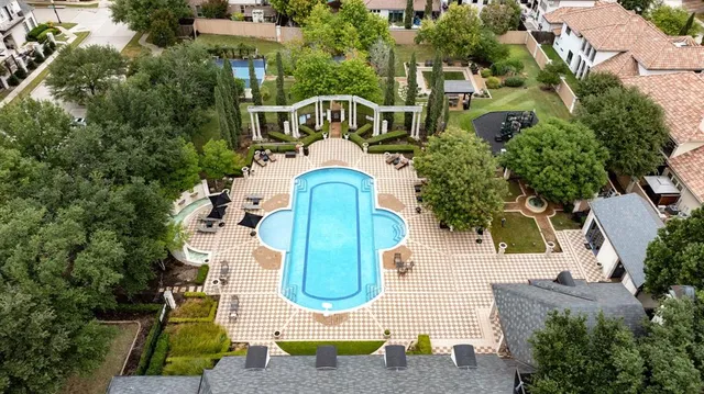 an aerial view of a house with a swimming pool