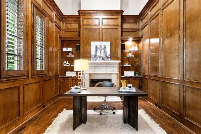 a view of balcony with two chairs and a potted plant