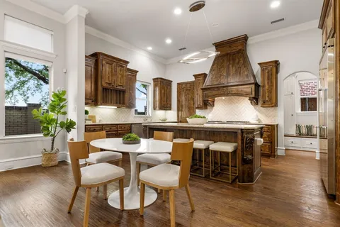 a dining room with furniture and wooden floor