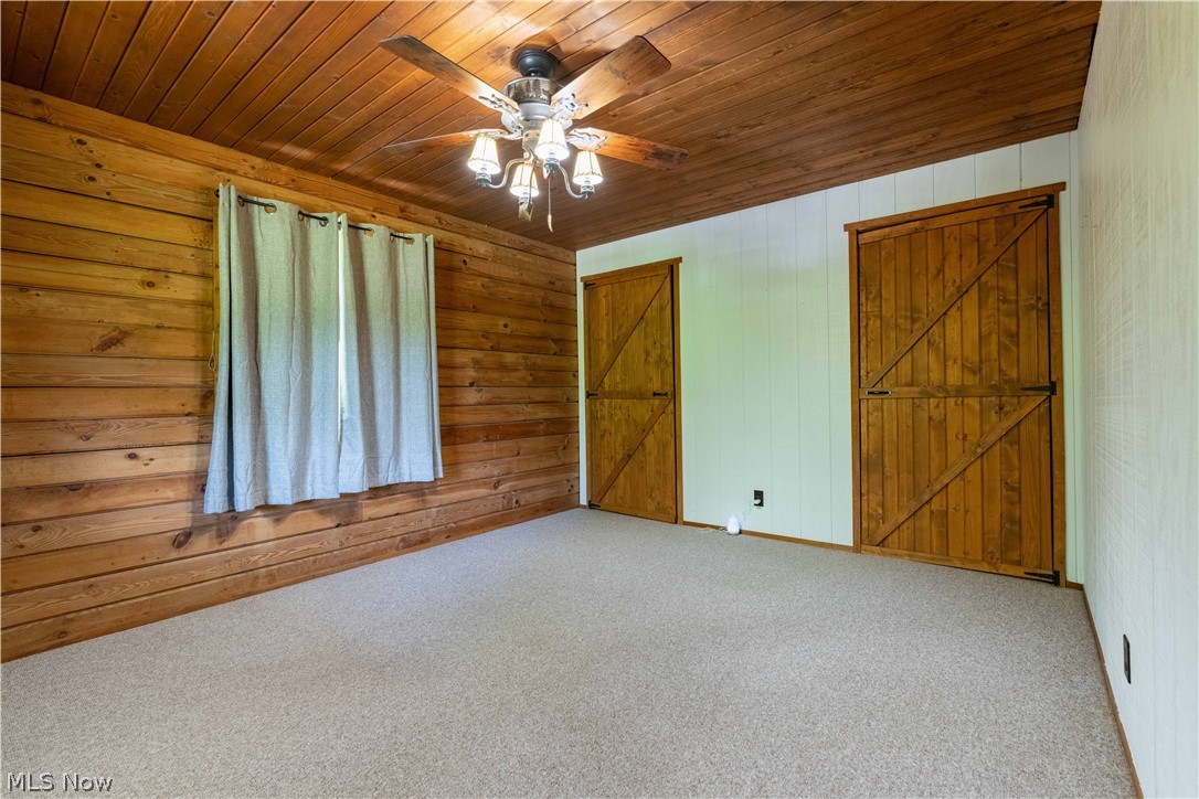 36048 South 16 Road Barnesville, OH 43713 - Photo 21 of 45 Unfurnished room featuring ceiling fan, carpet flooring, and wood ceiling