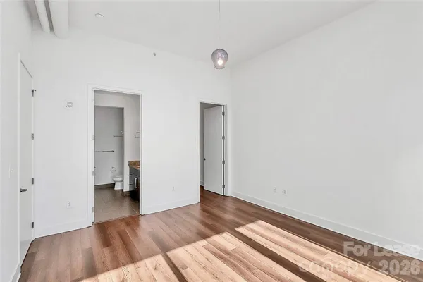 a view of hallway with wooden floor