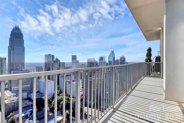 a view of a balcony with city view