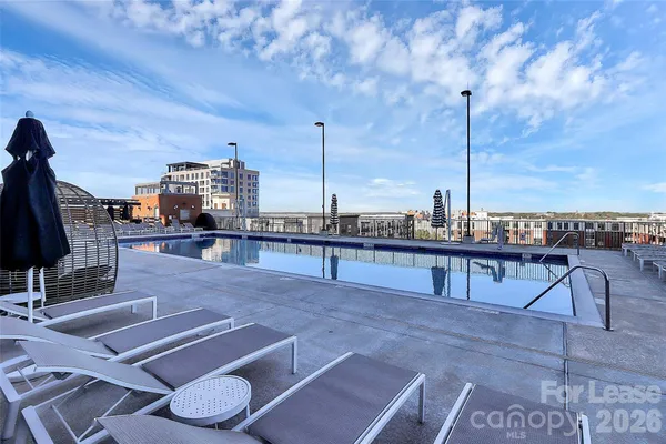 a room with lots of furniture and a large window