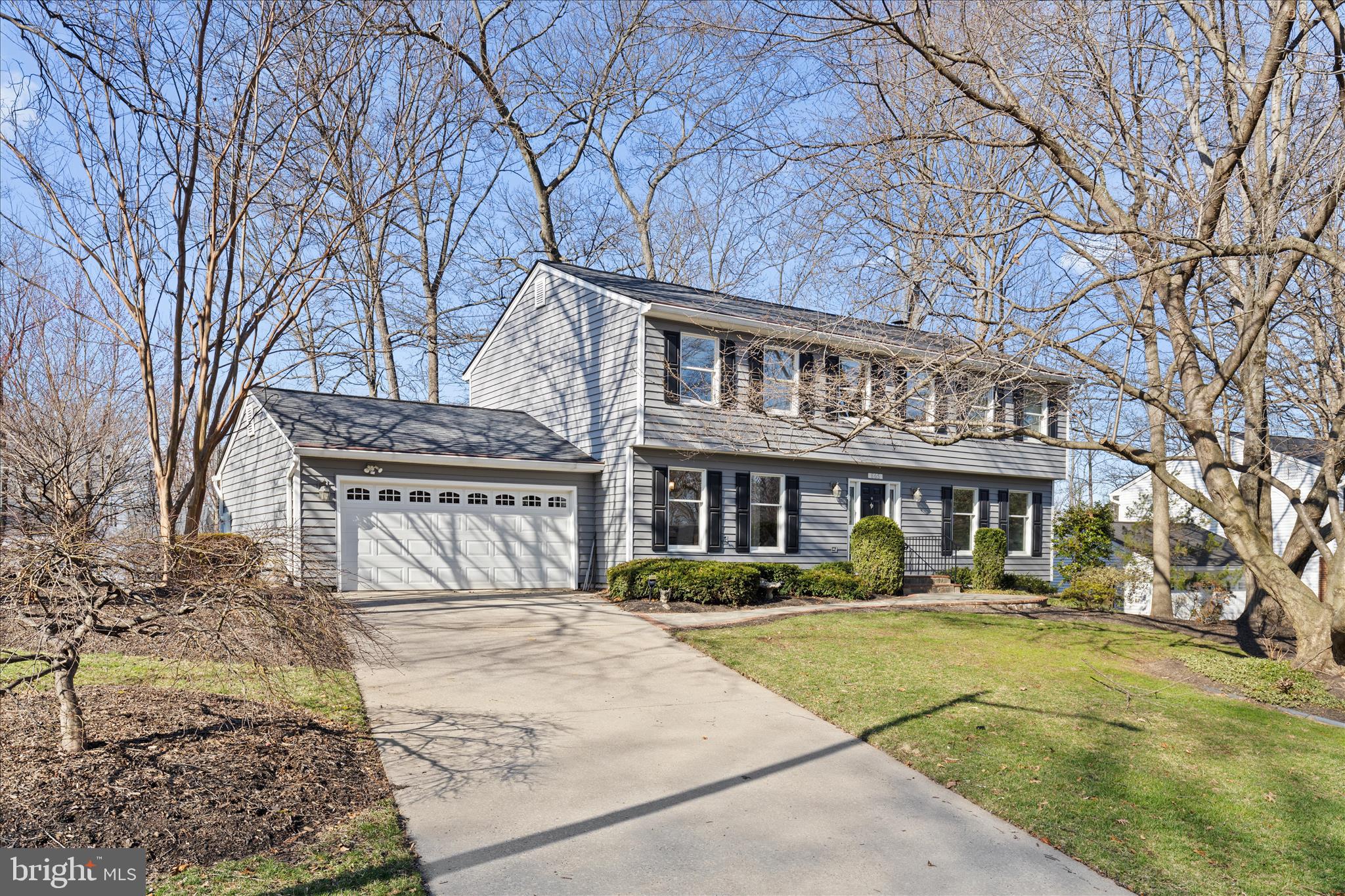 a front view of a building with a garden