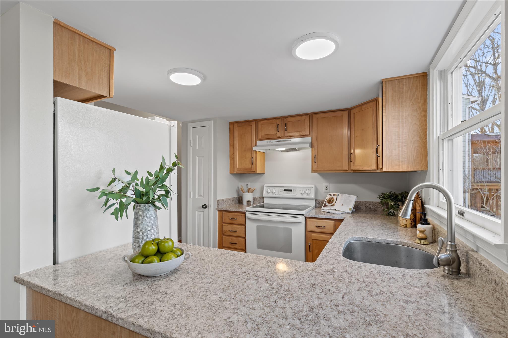865 Moffett Forge Road Herndon, VA 20170 - Photo 17 of 62 a kitchen with a sink a counter and cabinets