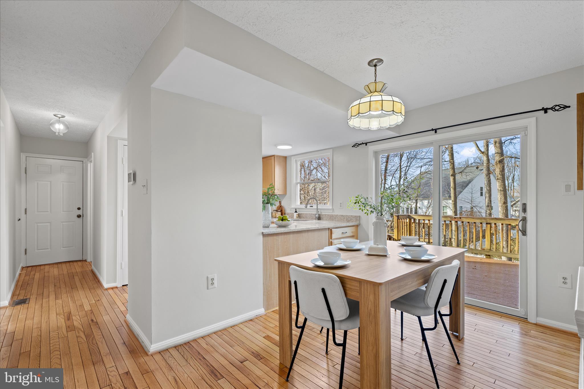 865 Moffett Forge Road Herndon, VA 20170 - Photo 19 of 62 a view of a dining room with furniture window and wooden floor