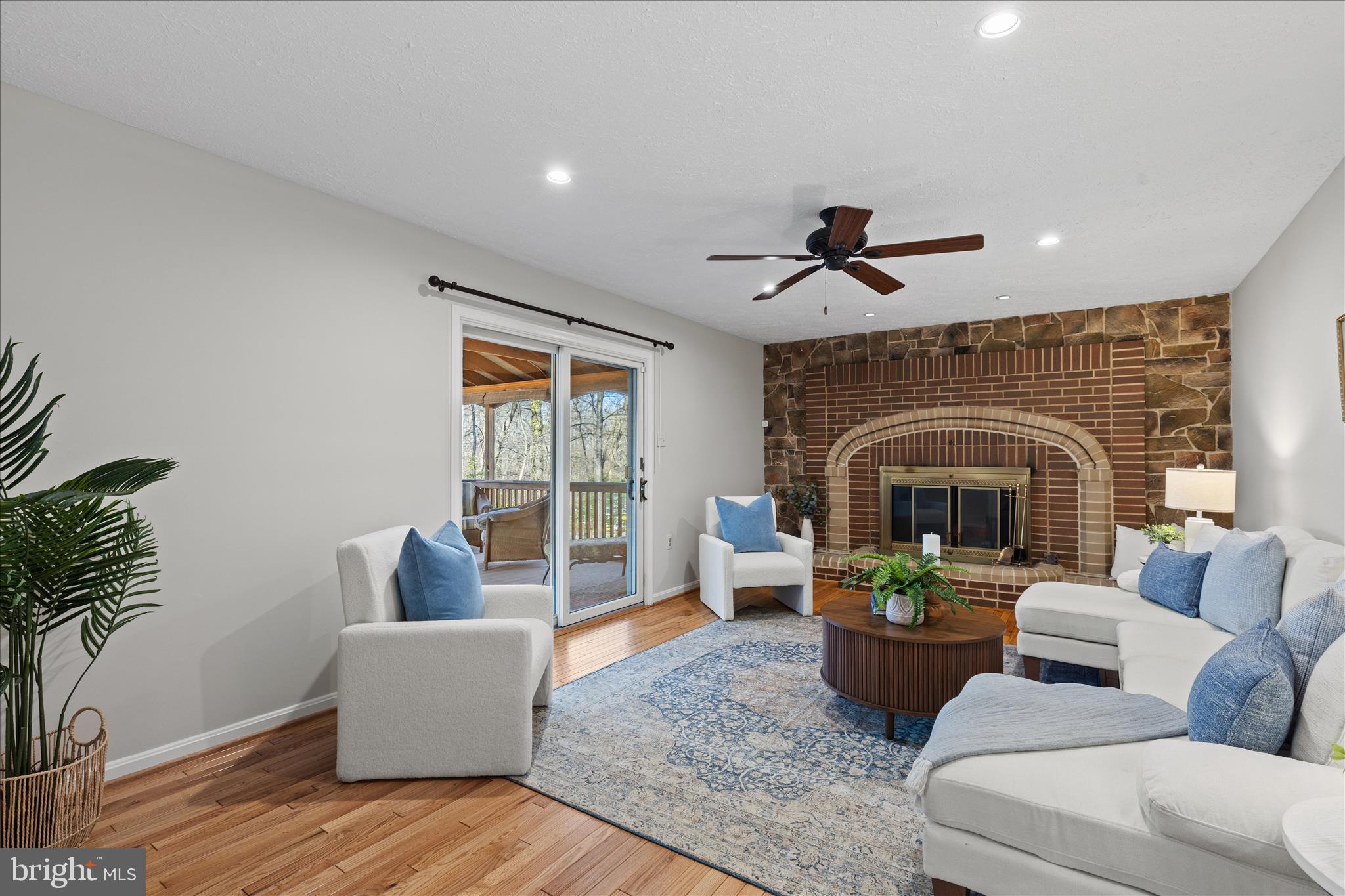 865 Moffett Forge Road Herndon, VA 20170 - Photo 20 of 62 a living room with furniture and a fireplace