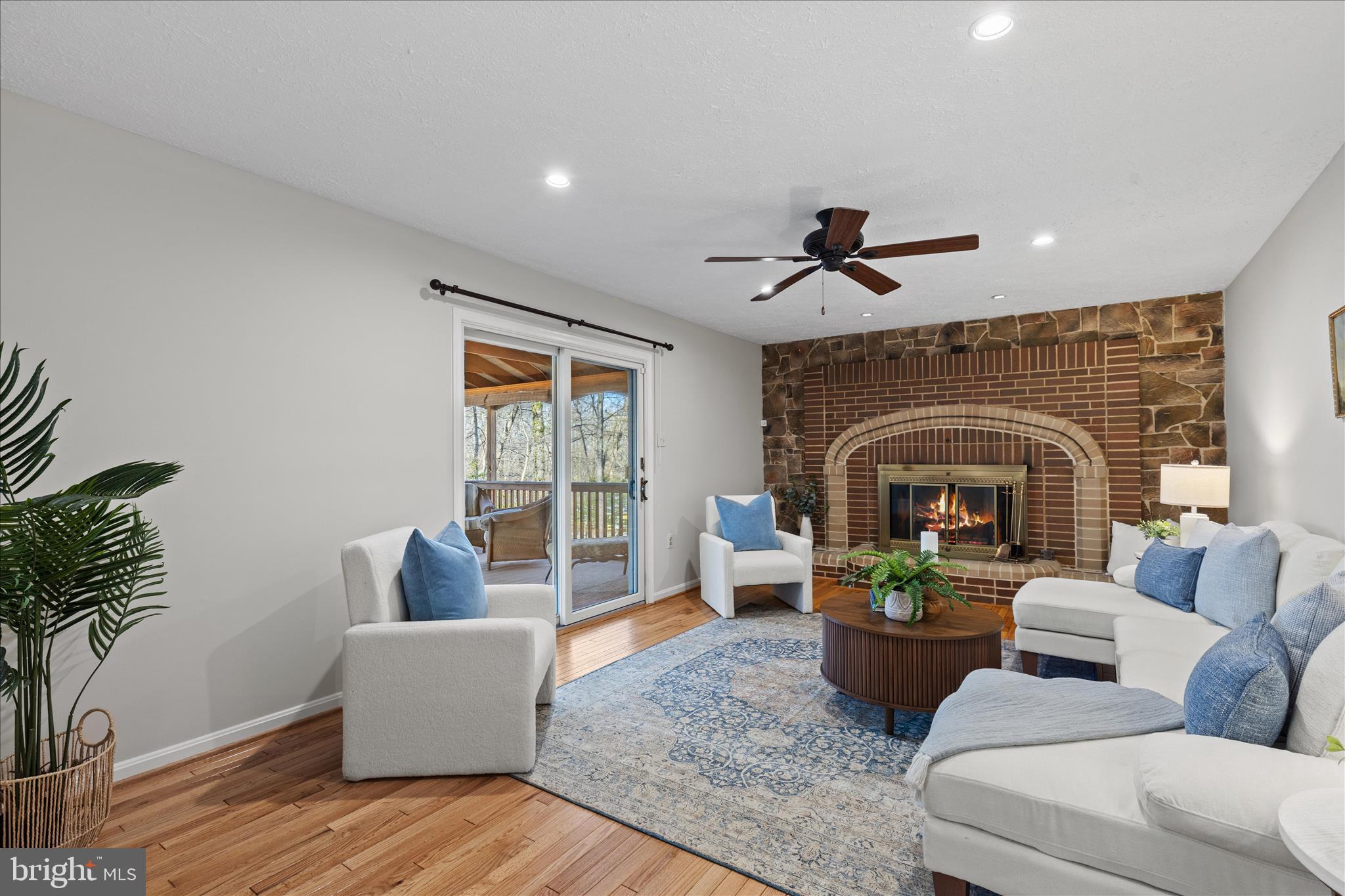 865 Moffett Forge Road Herndon, VA 20170 - Photo 21 of 62 a living room with furniture and a fireplace