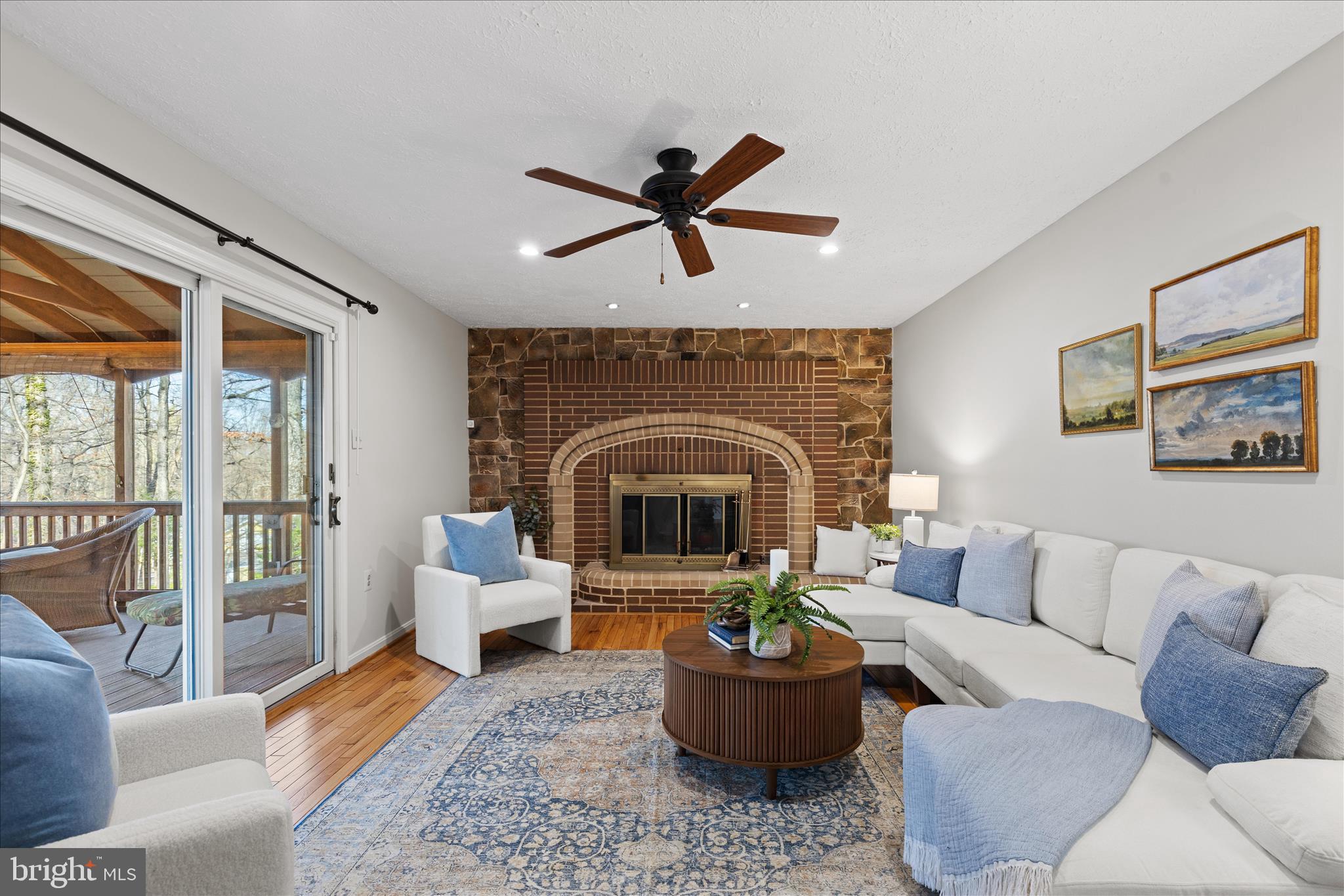 865 Moffett Forge Road Herndon, VA 20170 - Photo 22 of 62 a living room with furniture and a fireplace
