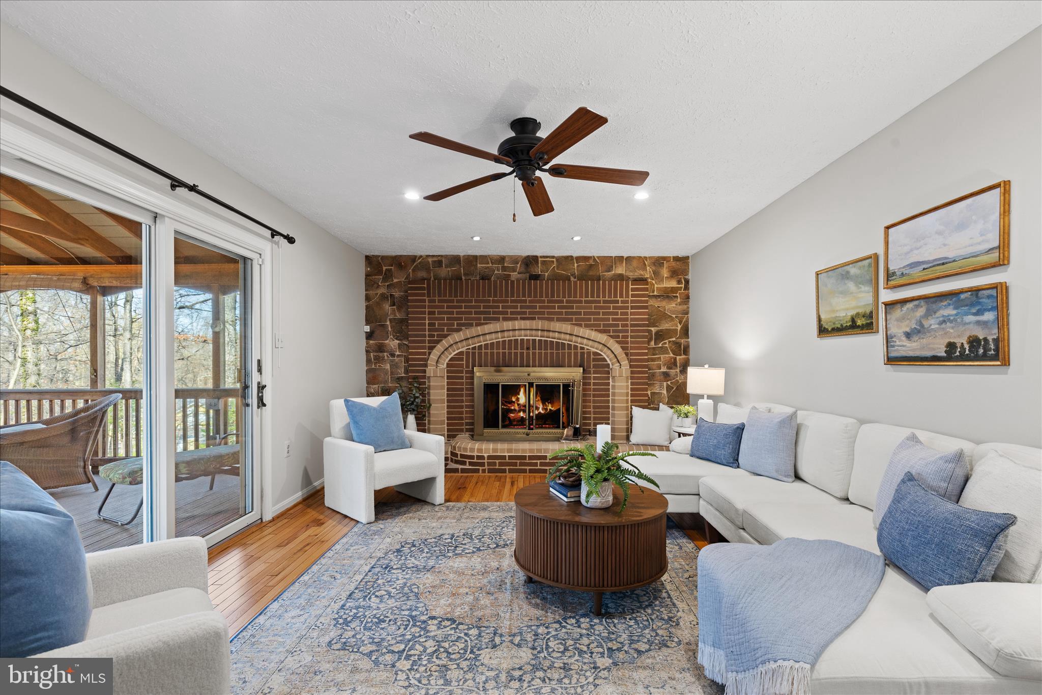 865 Moffett Forge Road Herndon, VA 20170 - Photo 23 of 62 a living room with furniture a fireplace and a potted plant