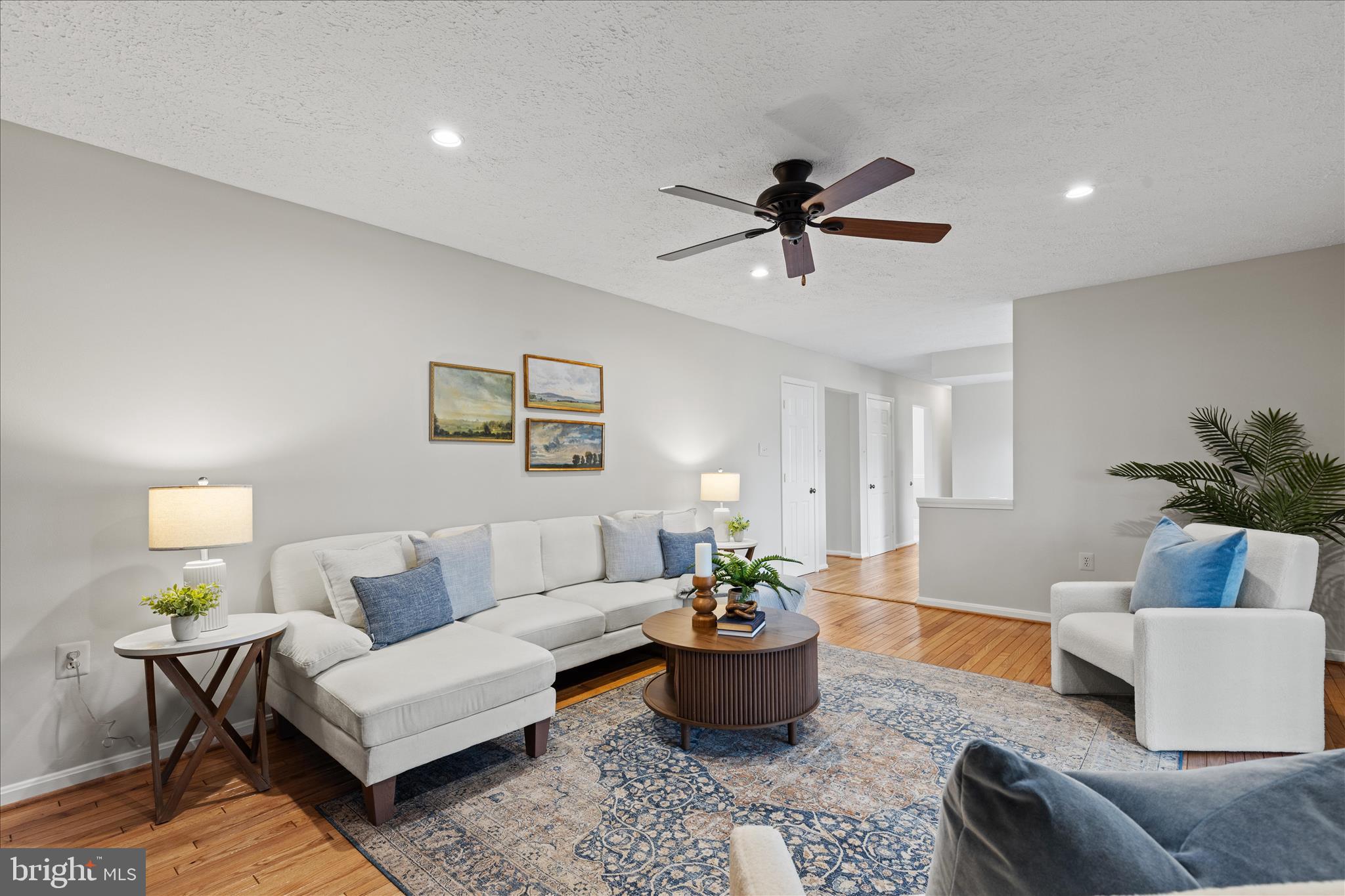 865 Moffett Forge Road Herndon, VA 20170 - Photo 25 of 62 a living room with furniture and a potted plant