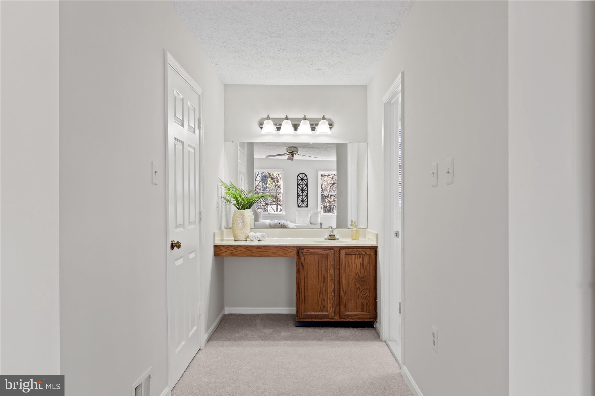 865 Moffett Forge Road Herndon, VA 20170 - Photo 29 of 62 a view of kitchen with kitchen island a sink wooden floor and view living room