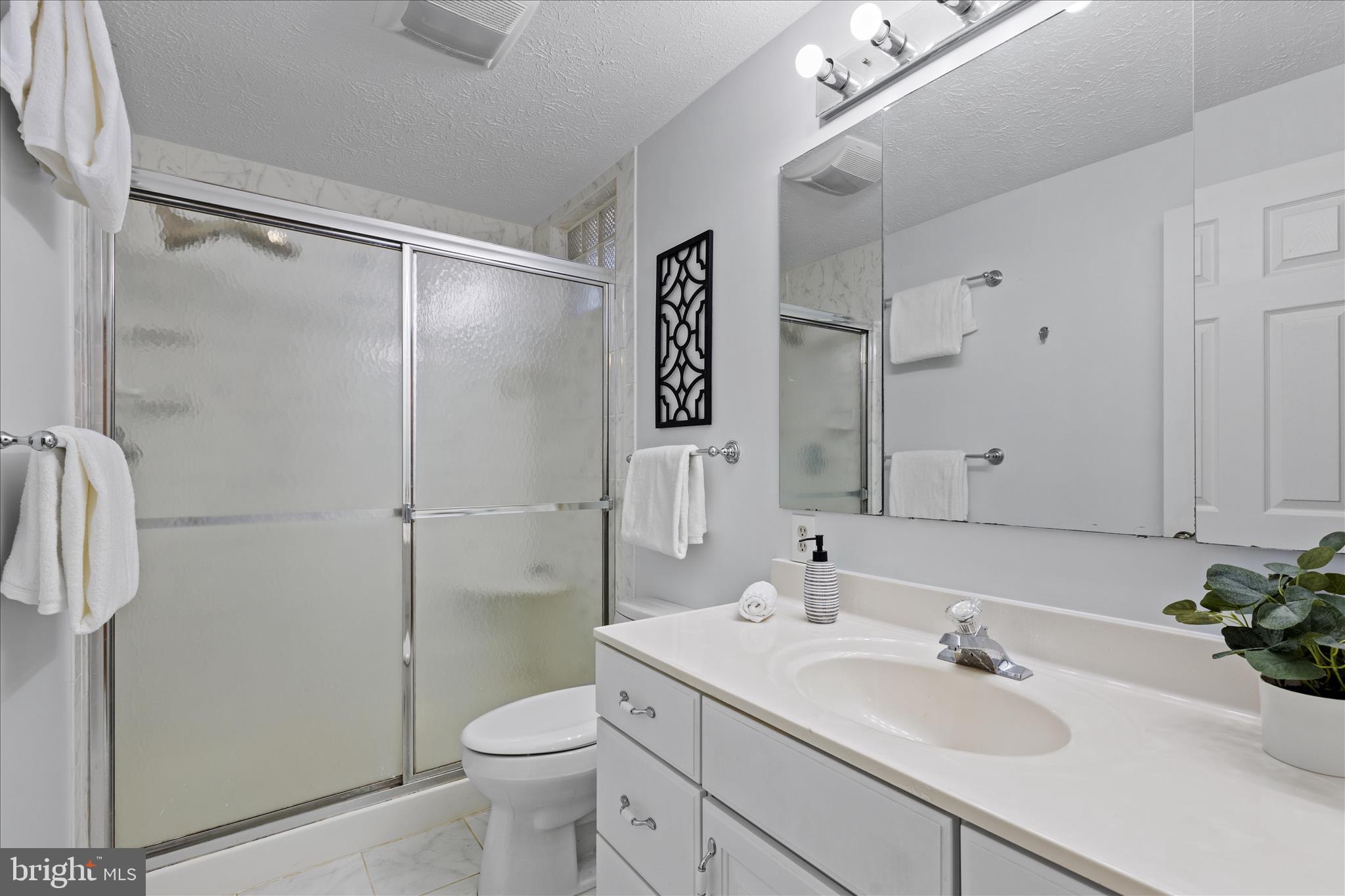 865 Moffett Forge Road Herndon, VA 20170 - Photo 44 of 62 a bathroom with a sink toilet and shower