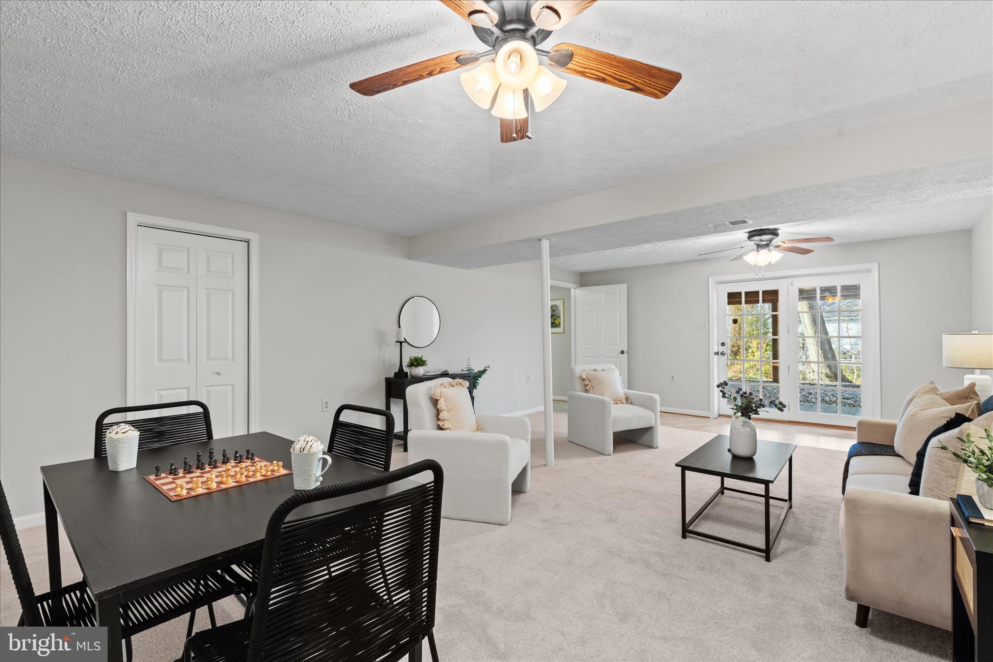 865 Moffett Forge Road Herndon, VA 20170 - Photo 46 of 62 a living room with furniture a chandelier and a window