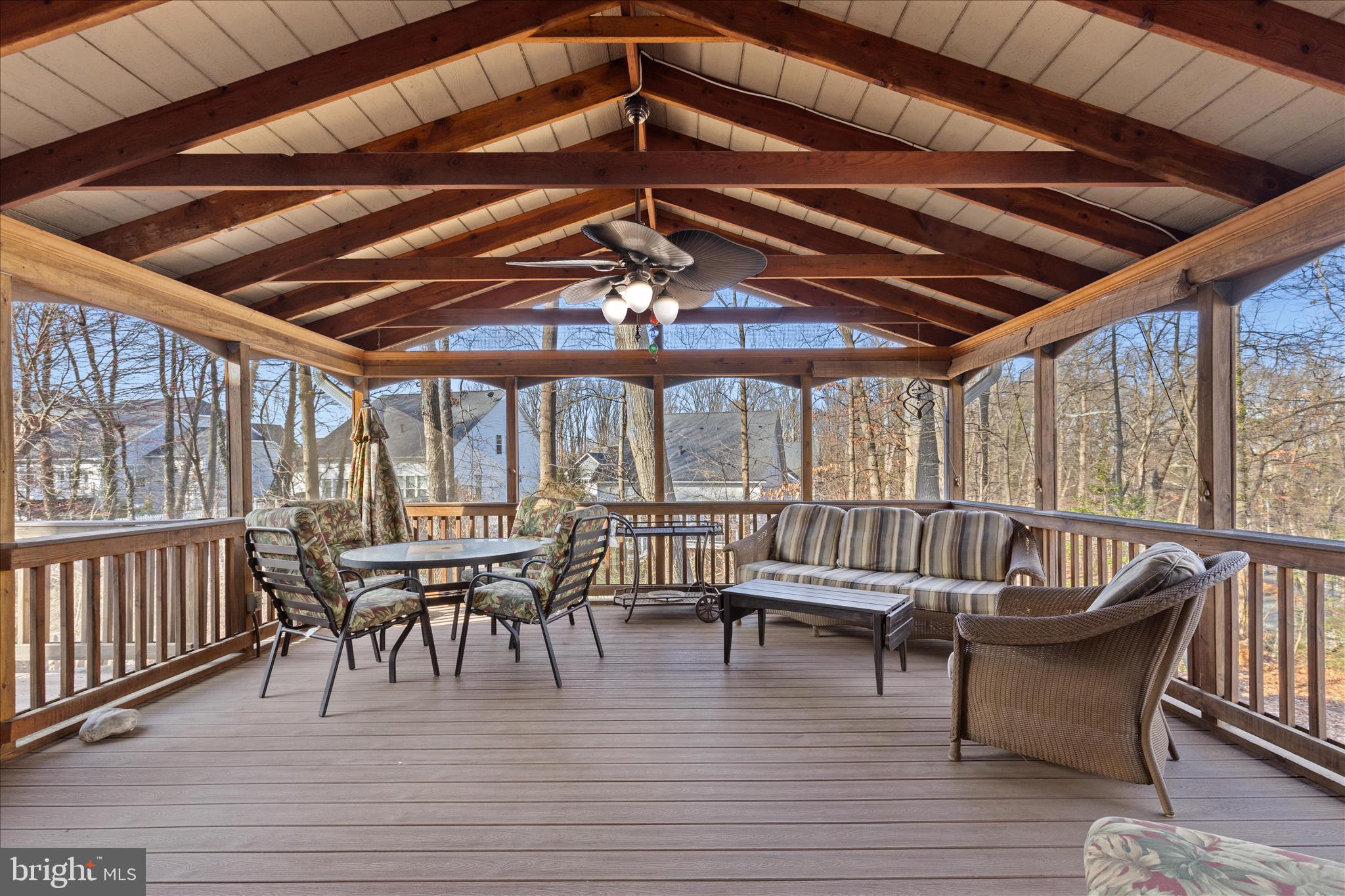 865 Moffett Forge Road Herndon, VA 20170 - Photo 50 of 62 a view of a roof deck with dining table and chairs with wooden floor