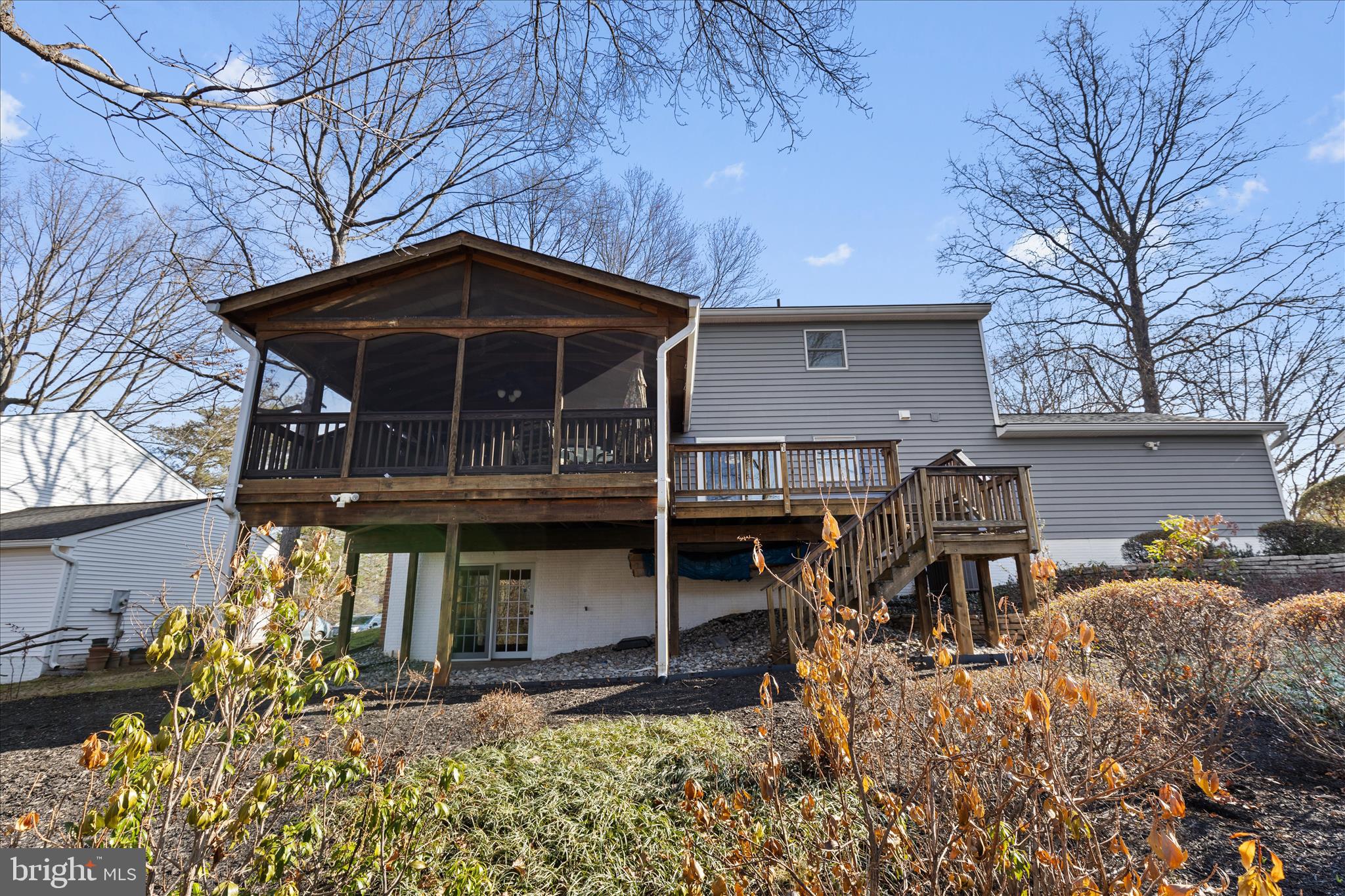 865 Moffett Forge Road Herndon, VA 20170 - Photo 58 of 62 a view of a house with large windows and a table and chairs
