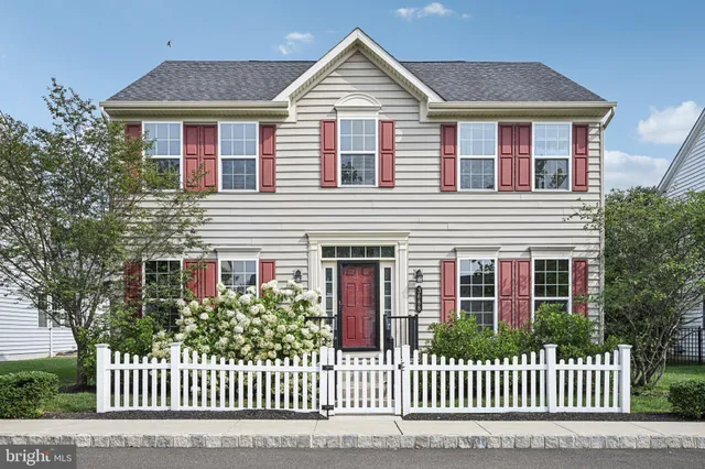 a front view of a house with a fence