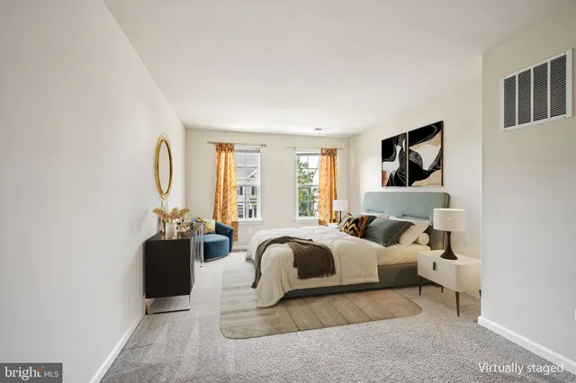 a bedroom with furniture and a couch