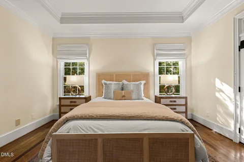 a spacious bedroom with a bed and a window