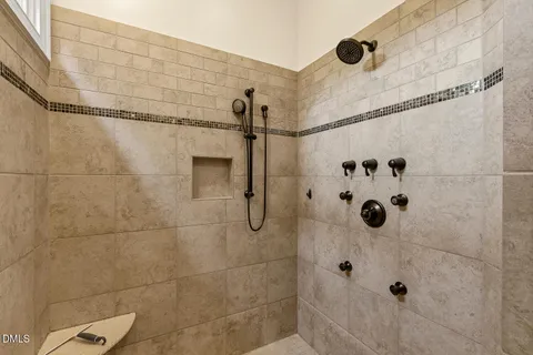 a dining room with furniture a fireplace and wooden floor