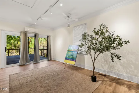 a view of deck with wooden floor and bench in the background