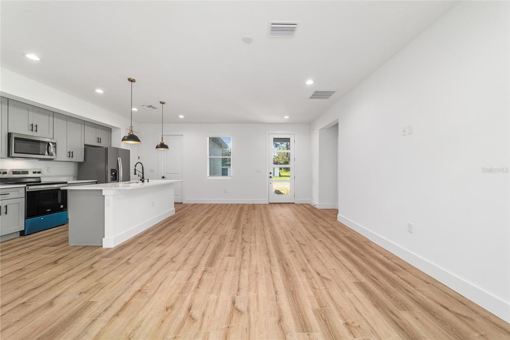 7 Oak Trail Ocala, FL 34472 - Photo 11 of 73 a view of kitchen with sink and wooden floor